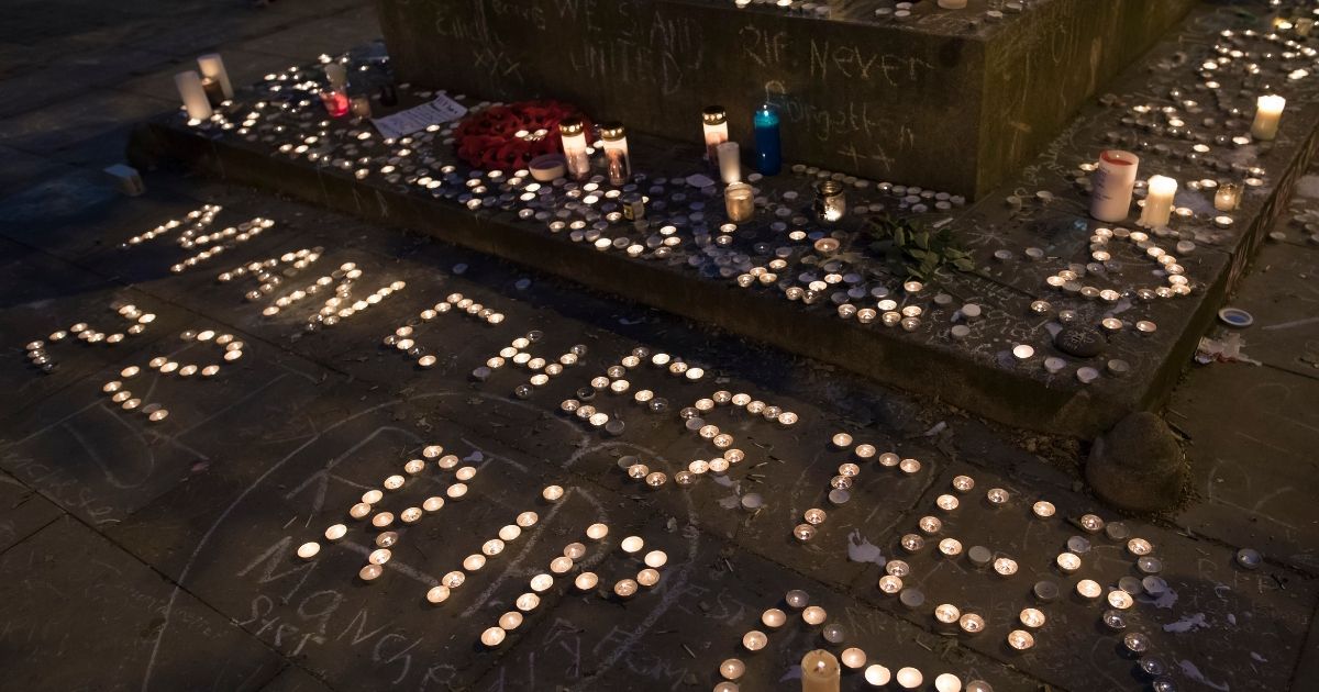 Memorial candles are seen during a vigil on St Ann's Square in Manchester, northwest England, on May 29, 2017, exactly one week after a bomb attack at Manchester Arena killed 22 and injured hundreds more.