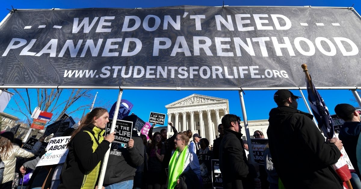 People participate in the March for Life near the Supreme Court in Washington on Jan. 19, 2018.