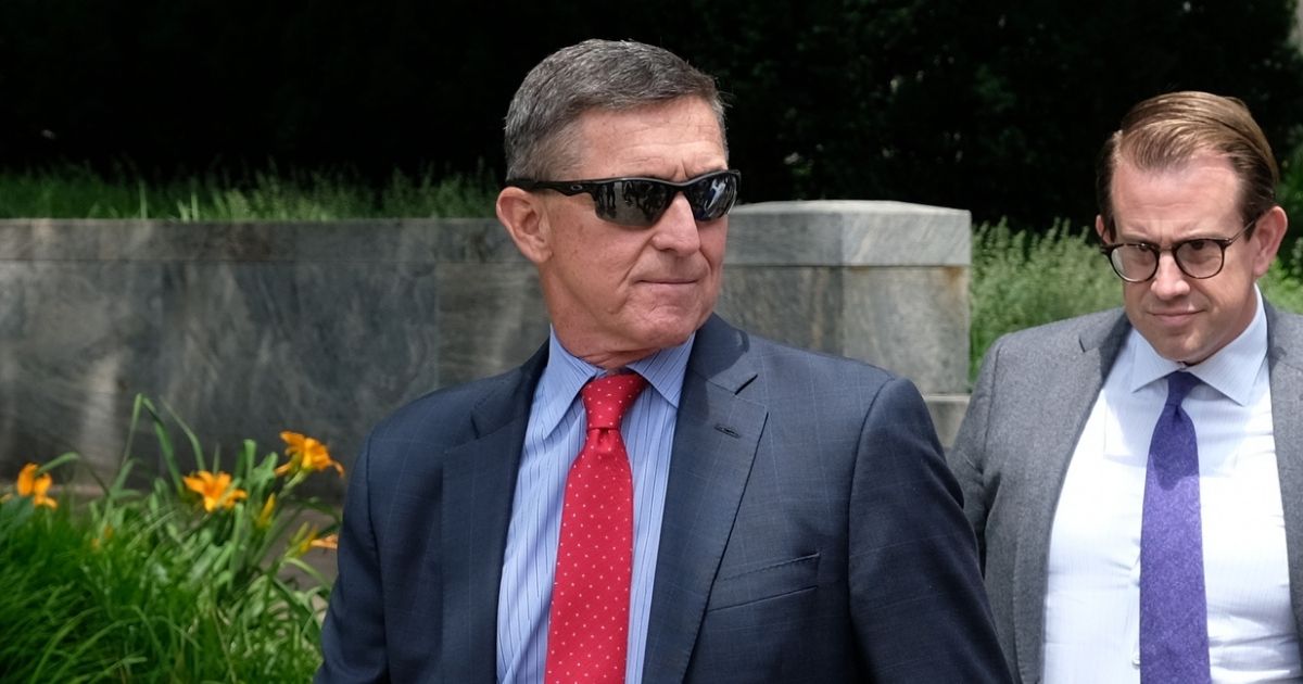 Former National Security Advisor Michael Flynn, left, leaves the E. Barrett Prettyman U.S. Courthouse on June 24, 2019, in Washington, D.C.