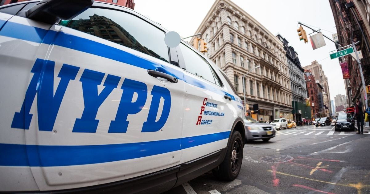 The above stock image shows a close up of the New York Police Department logo on a police car.
