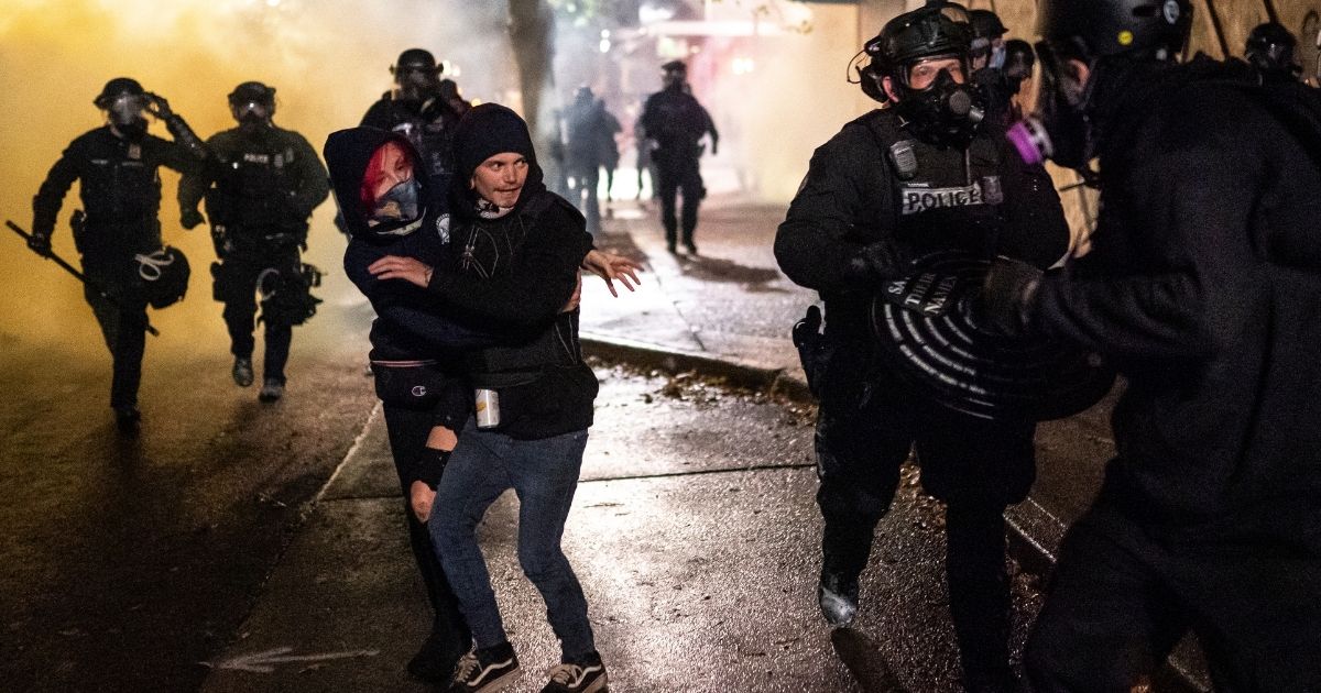 Protesters clash with police officers on Sept. 23, 2020, in Portland, Oregon.