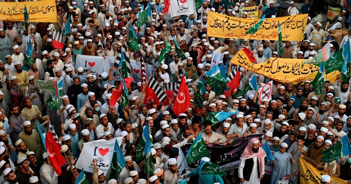 Muslim demonstrators march Wednesday in Lahore, Pakistan, to condemn French President Emmanuel Macron's comments about images of the Prophet Muhammad.