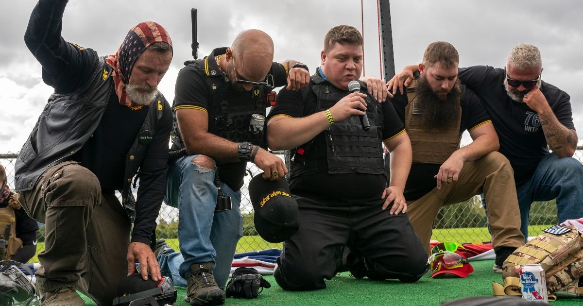 Leaders of the Proud Boys pray before a rally in Portland, Oregon, on Sept. 26, 2020.