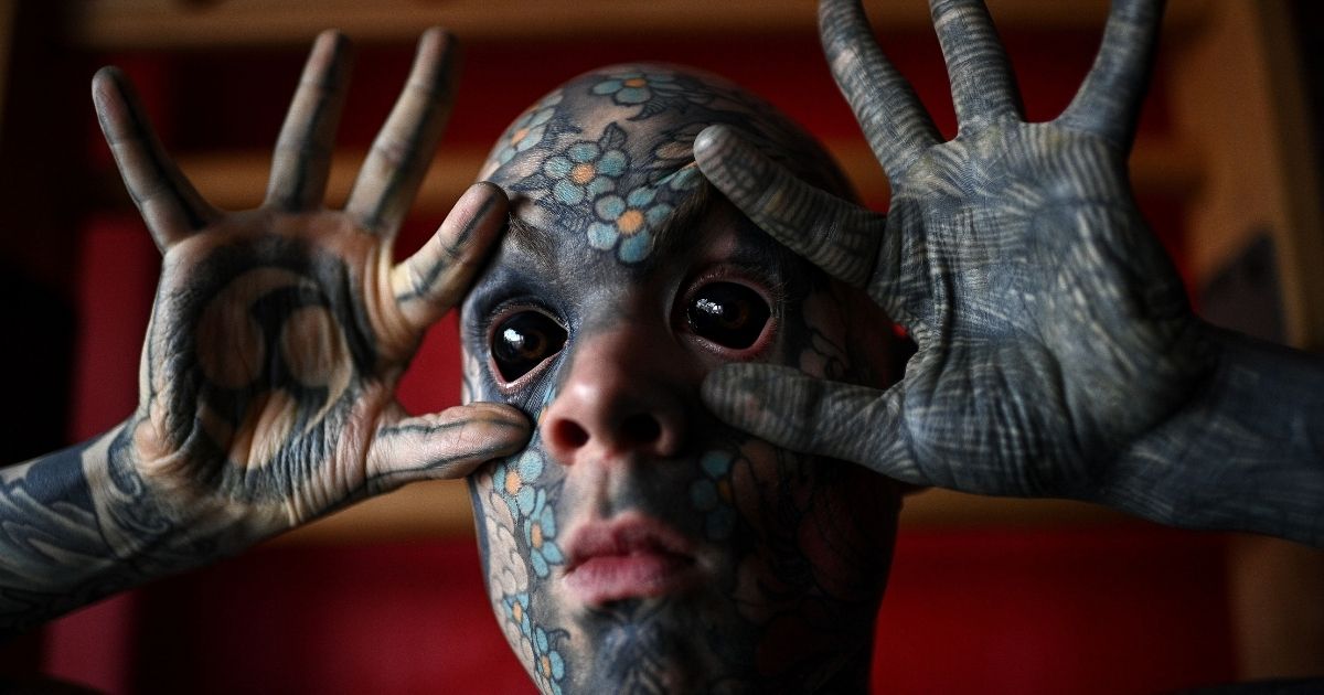 French primary school teacher and tattoo enthusiast Sylvain Helaine, known as Freaky Hoody, poses during a photo session in Palaiseau, a south of Paris suburb, on Sept. 22, 2020.