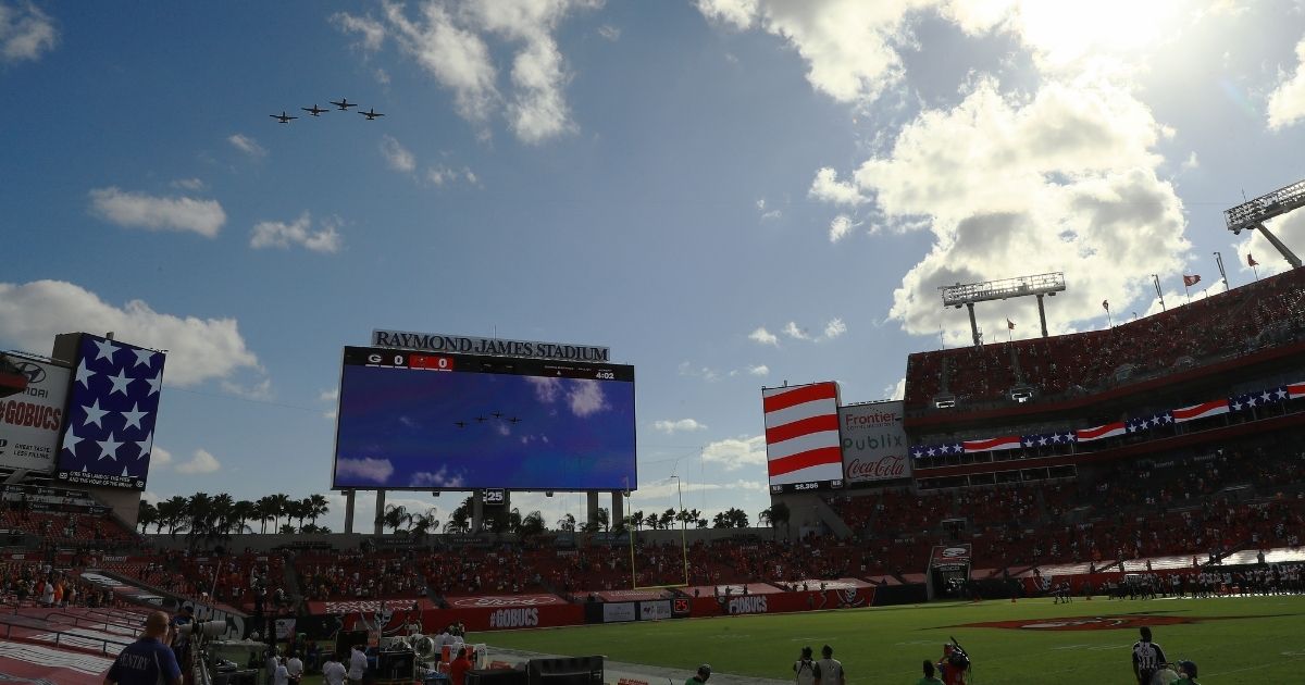 Military aircraft fly over Raymond James Stadium in Tampa, Florida, before the start of a game between the Tampa Bay Buccaneers and the Green Bay Packers on Sunday.