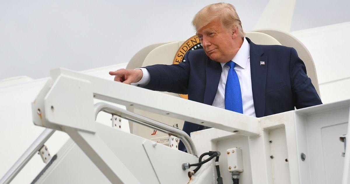 President Donald Trump steps off Air Force One upon arrival at Rickenbacker International Airport in Columbus, Ohio, on Saturday.