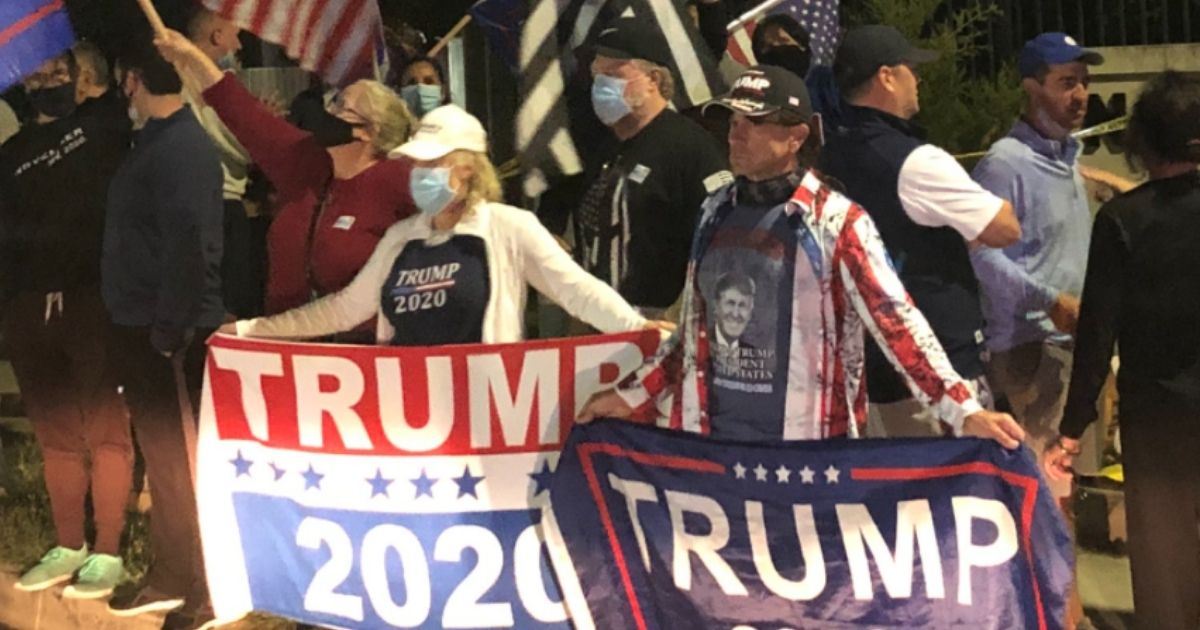 Trump supporters gather outside of Walter Reed National Military Medical Center, where President Donald Trump is currently staying following his COVID-19 diagnosis.