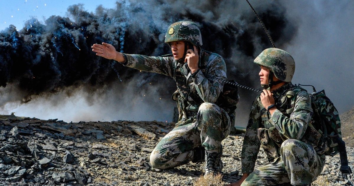 A commanding soldier assigned to a combined arms brigade under the PLA 76th Group Army gives instructions during a real-combat drill on Sept. 26, 2020.