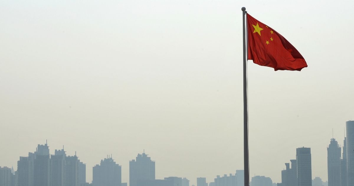 The Chinese flag flies in Shanghai.