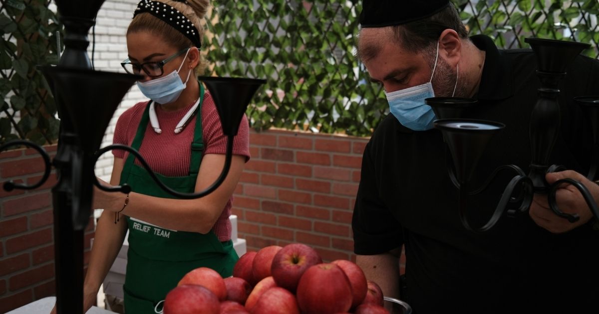 Preparations are made for an evening meal at Masbia, a nonprofit soup kitchen and food pantry in a Hasidic neighborhood in New York City, as the community gets ready for the start of Rosh Hashanah on Sept. 18, 2020.