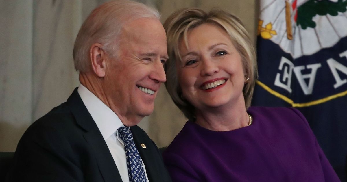 WASHINGTON, DC - DECEMBER 08: Former US Secretary of State, Hillary Clinton shares a laugh with US Vice President Joseph Biden, during a portrait unveiling ceremony for outgoing Senate Minority Leader Harry Reid (D-NV), on Capitol Hill December 8, 2016 in Washington, DC.
