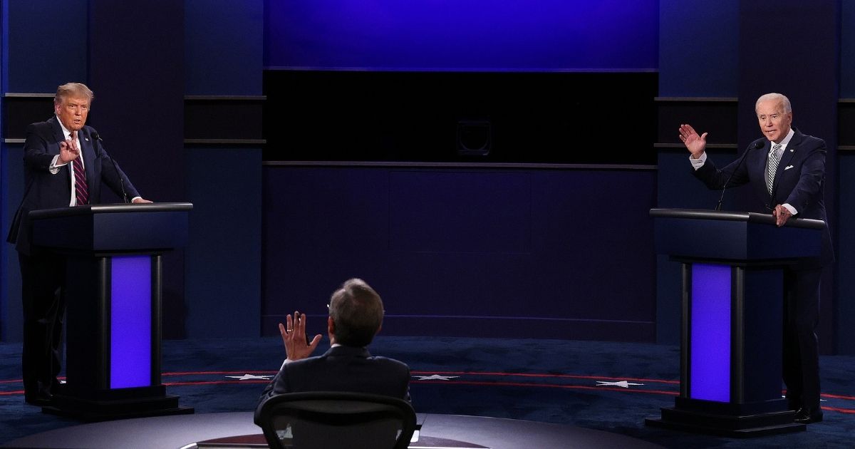 CLEVELAND, OHIO - SEPTEMBER 29: U.S. President Donald Trump and Democratic presidential nominee Joe Biden participate in the first presidential debate moderated by Fox News anchor Chris Wallace (C) at the Health Education Campus of Case Western Reserve University on September 29, 2020 in Cleveland, Ohio. This is the first of three planned debates between the two candidates in the lead up to the election on November 3.