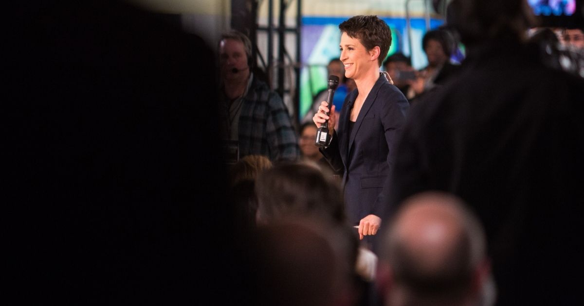 FLINT, MI - JANUARY 27: MSNBC's Rachel Maddow introduces herself to the crowd prior to taping her town hall special on January 27, 2016 at Holmes STEM Academy in Flint, Michigan. Maddow's program came to Flint to discuss the city's water contamination and the federal state of emergency.