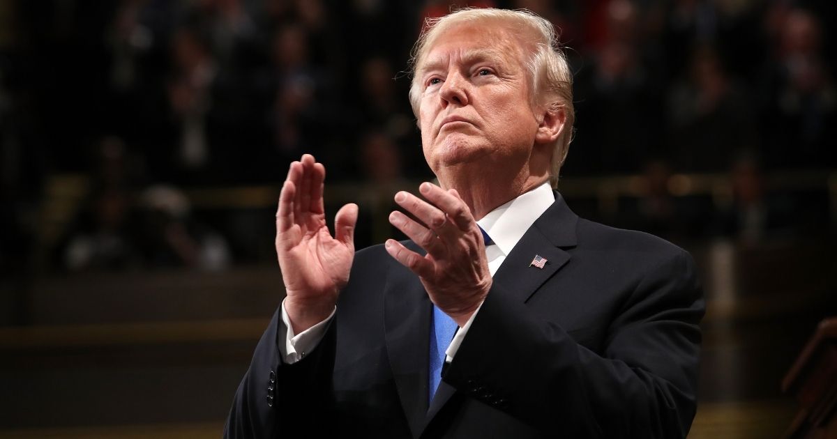WASHINGTON, DC - JANUARY 30: U.S. President Donald J. Trump claps during the State of the Union address in the chamber of the U.S. House of Representatives January 30, 2018 in Washington, DC. This is the first State of the Union address given by U.S. President Donald Trump and his second joint-session address to Congress.