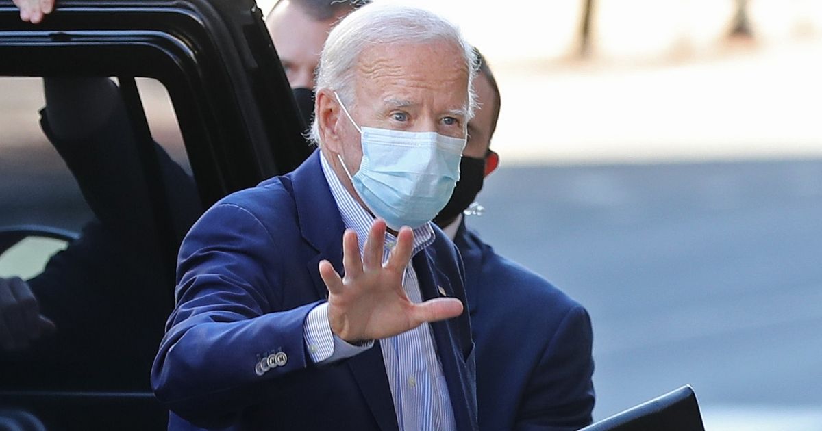Former Vice President and Democratic presidential nominee Joe Biden enters a Wilmington, Delaware, venue for a "town hall" event on Oct. 3.