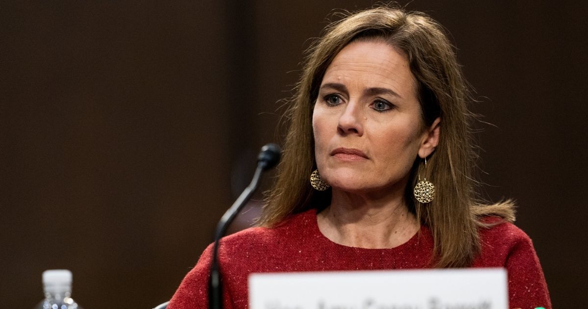 Supreme Court nominee Judge Amy Coney Barrett listens Tuesday on the second day of her Supreme Court confirmation hearing before the Senate Judiciary Committee on Capitol Hill.