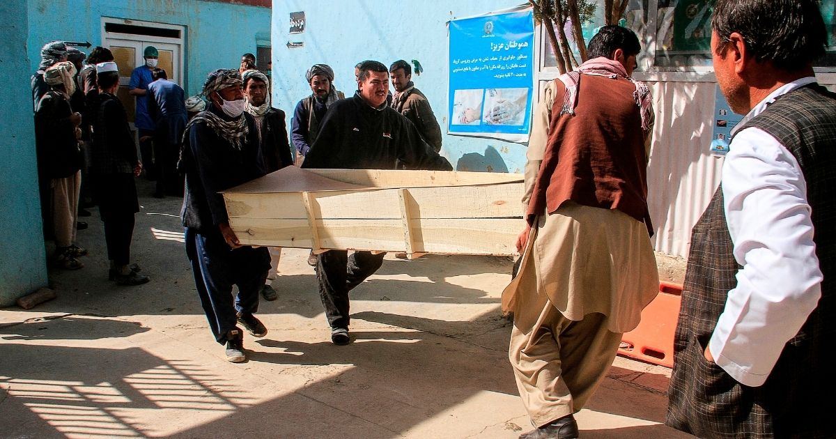 Relatives carry the coffin of a victim who was killed by a roadside bomb in Ghazni province, Afghanistan, on Oct. 24, 2020.