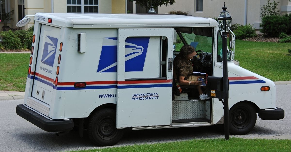 A U.S. Postal worker is seen in the stock image above. One mailman in Norwalk, California, helped save a resident last week after the man cut his arm with a chainsaw.