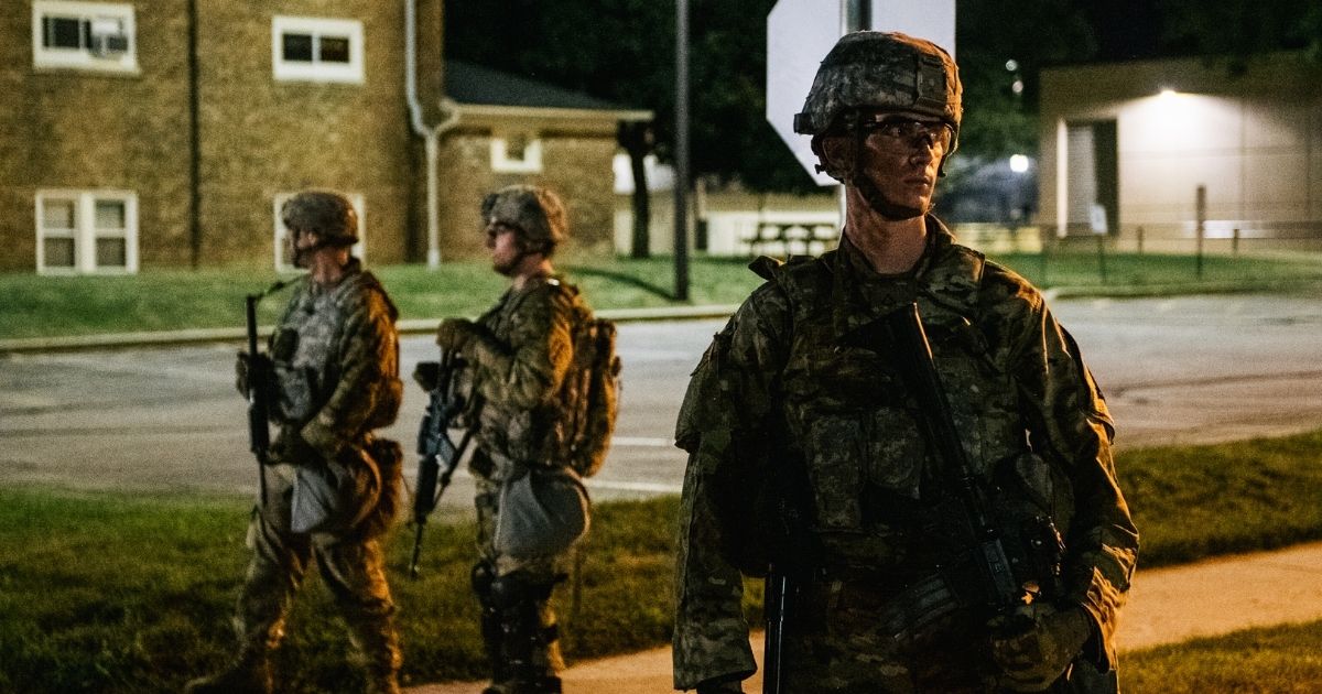 National Guard troops stand guard outside government buildings on Aug, 27, 2020, in Kenosha, Wisconsin.