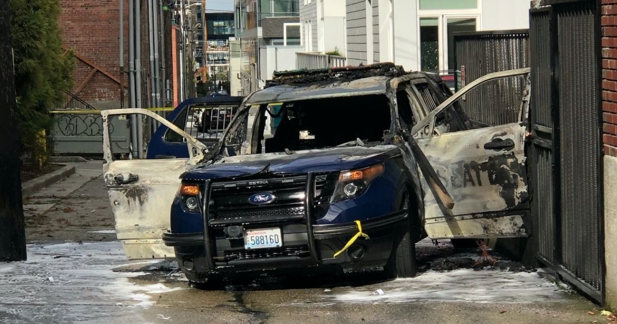 A Seattle man was arrested on Oct. 16, 2020, after allegedly throwing a burning piece of wood into a police vehicle with an officer inside.