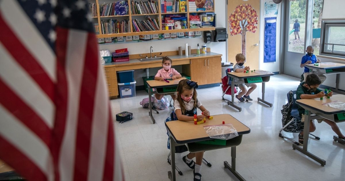 Children take part in class on their first day of kindergarten on Sept. 9, 2020, in Stamford, Connecticut.
