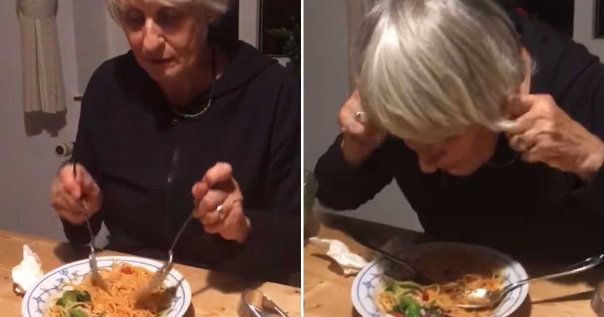 A woman demonstrates an amusing way to eat spaghetti.