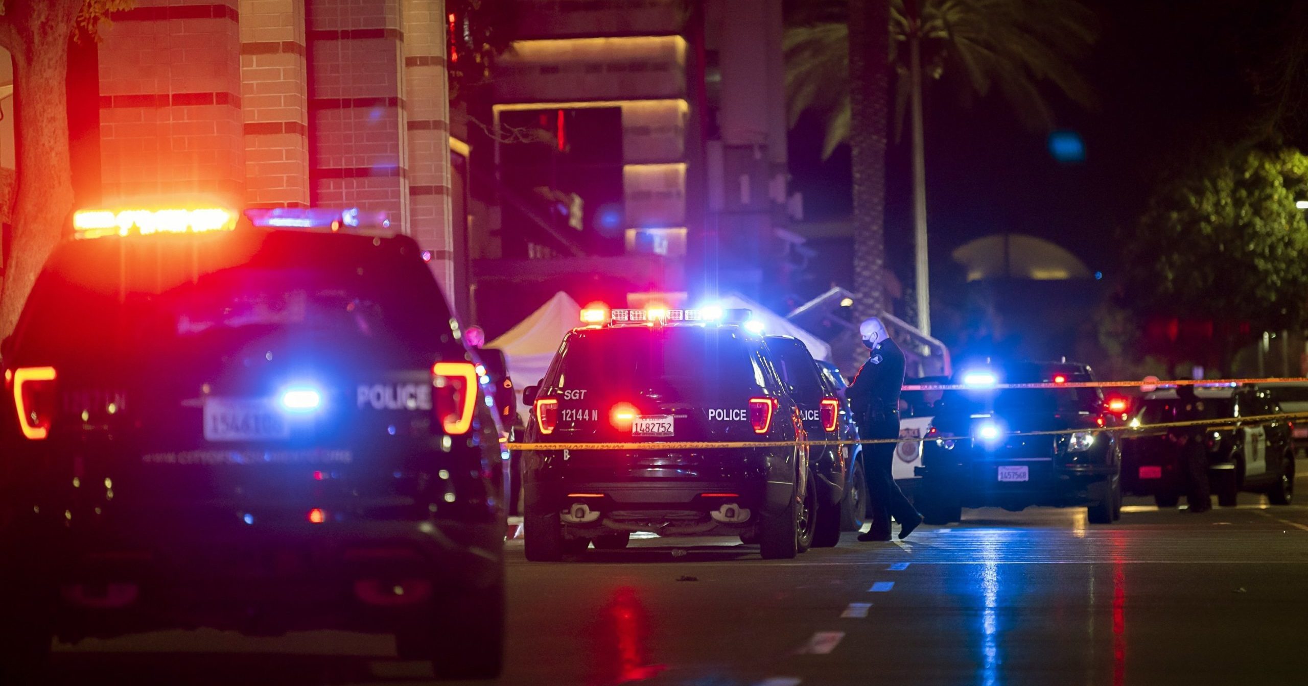 Police stand outside a mall after a shooting that left one person dead and another critically injured on Nov. 27, 2020, in Sacramento, California.