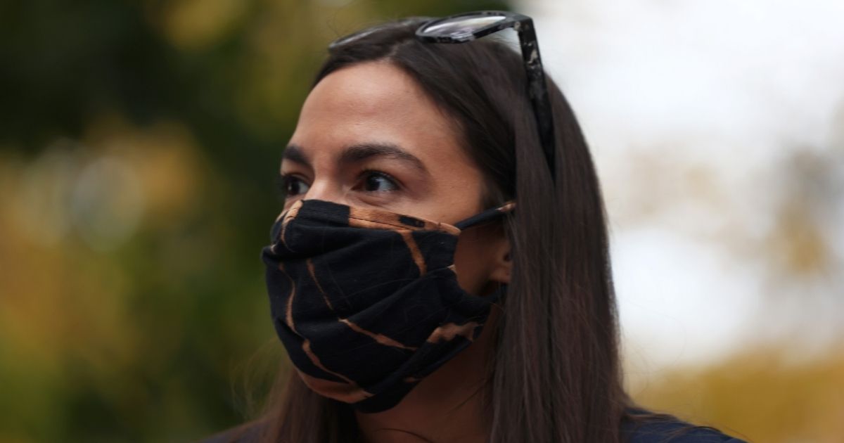 New York Democratic Rep. Alexandria Ocasio-Cortez looks out toward a crowd during a food distribution event on Oct. 27, 2020, in New York City.