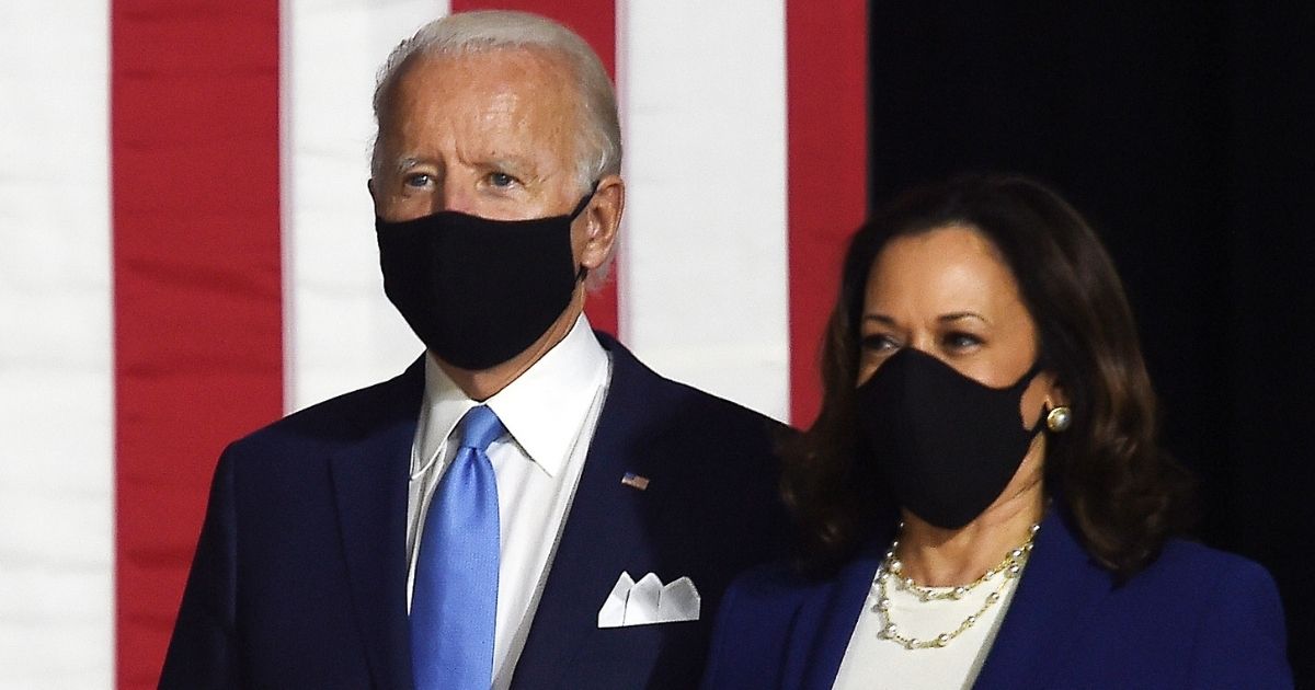 Democratic presidential nominee Joe Biden and his running mate, Sen. Kamala Harris, arrive for a news conference in Wilmington, Delaware, on Aug. 12.