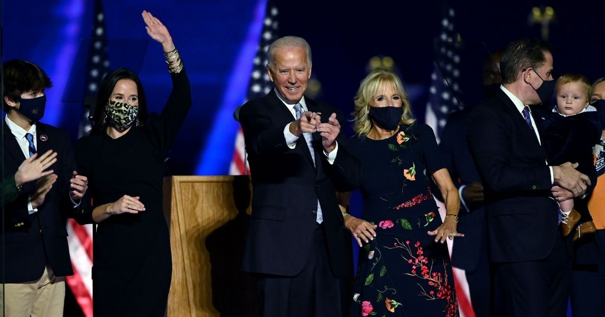 Hunter Biden, right, and other members of the Biden family stand on stage after Democratic presidential candidate Joe Biden delivered a victory speech Saturday in Wilmington, Delaware.