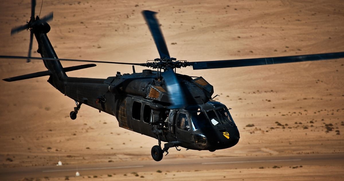 An Army Black Hawk helicopter crew makes a return flight to Camp Taji, Iraq, after a training mission Aug. 18, 2009.