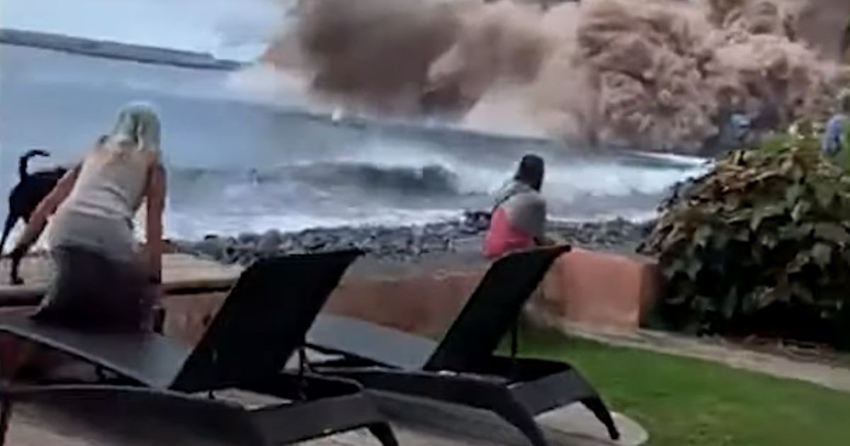 A massive collapse of a cliff in the Canary Islands triggered the evacuation of a nearby beach where tourists watched the collapse.