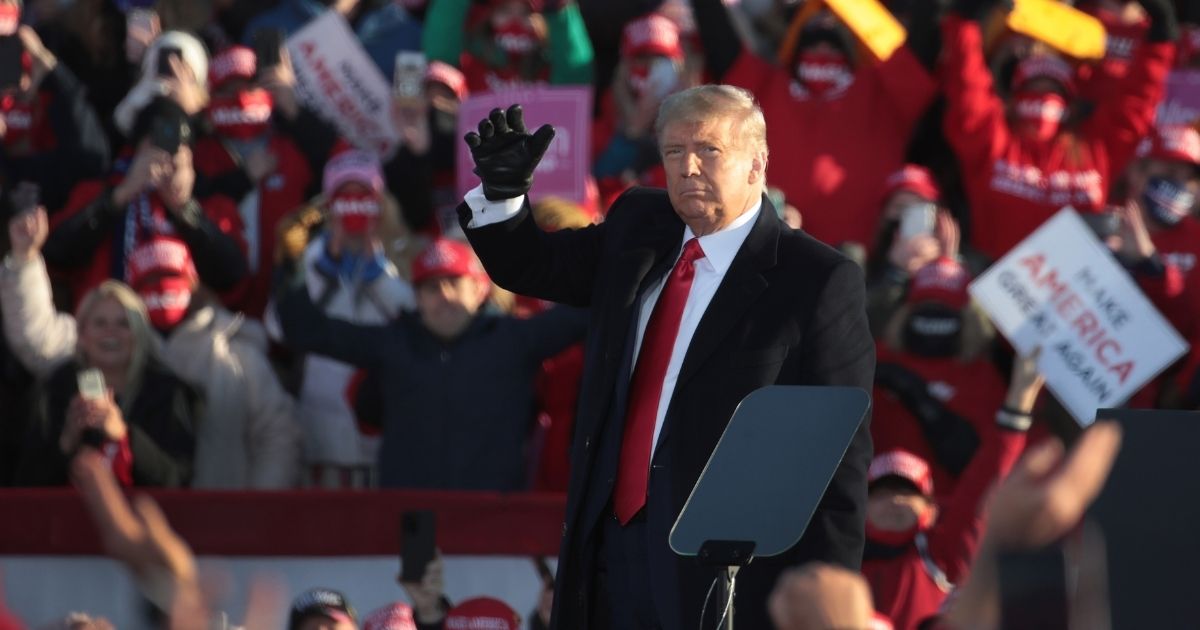 President Donald Trump waves as he departs a campaign rally at Green Bay-Austin Straubel International Airport last week in Green Bay, Wisconsin.