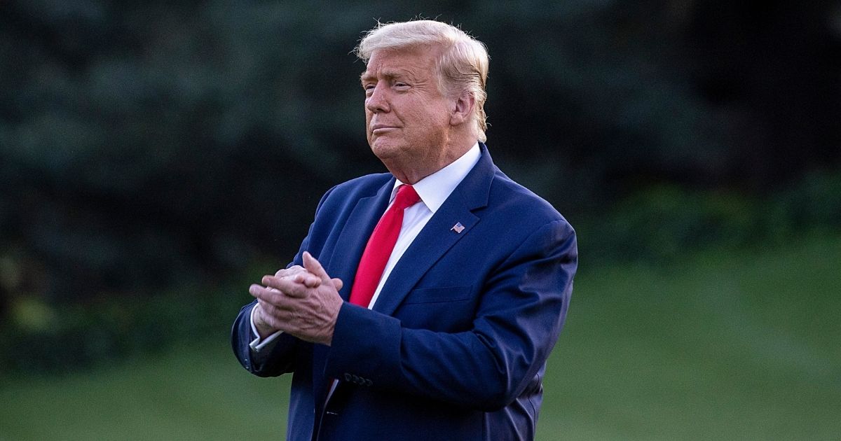 President Donald Trump walks on the south lawn of the White House on Oct. 20, 2020.