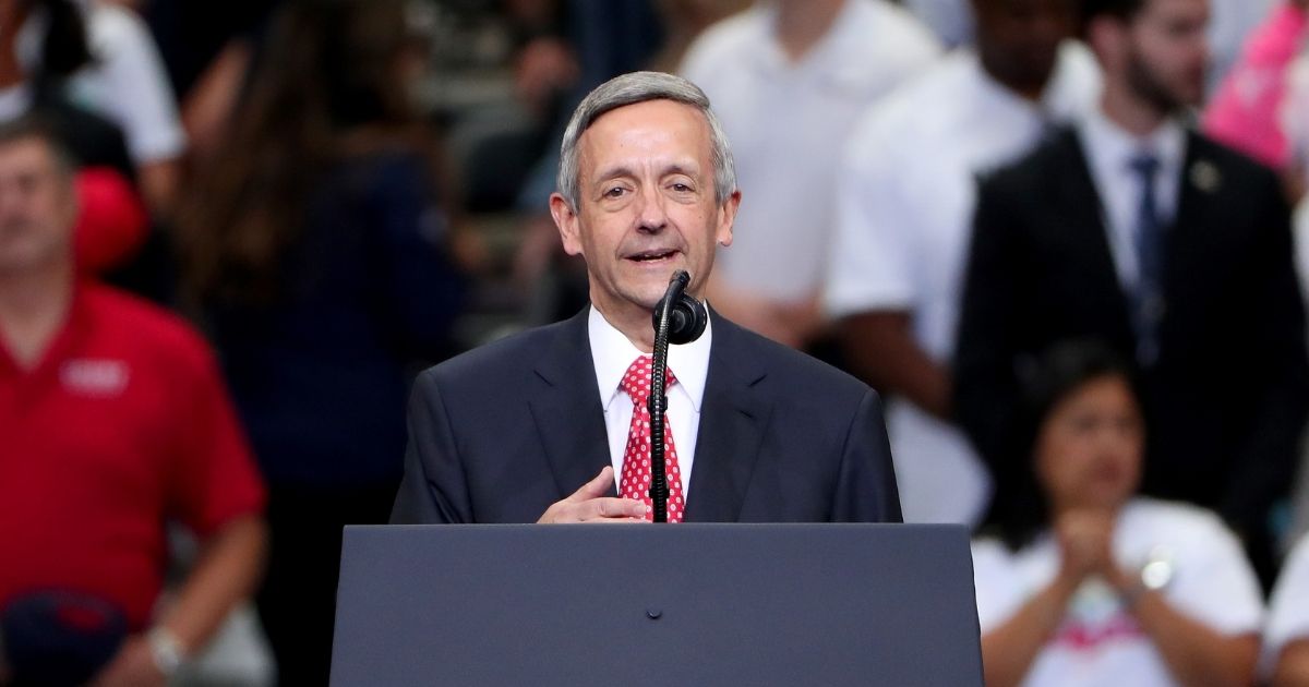 Evangelical pastor Robert Jeffress leads the Pledge of Allegiance before President Donald Trump speaks during a "Keep America Great" campaign rally at American Airlines Center on Oct. 17, 2019, in Dallas.
