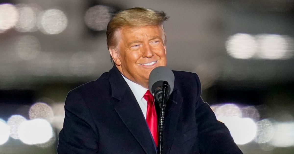 President Donald Trump smiles as he addresses the crowd during a campaign stop Saturday at the Butler County Regional Airport in Butler, Pennsylvania.