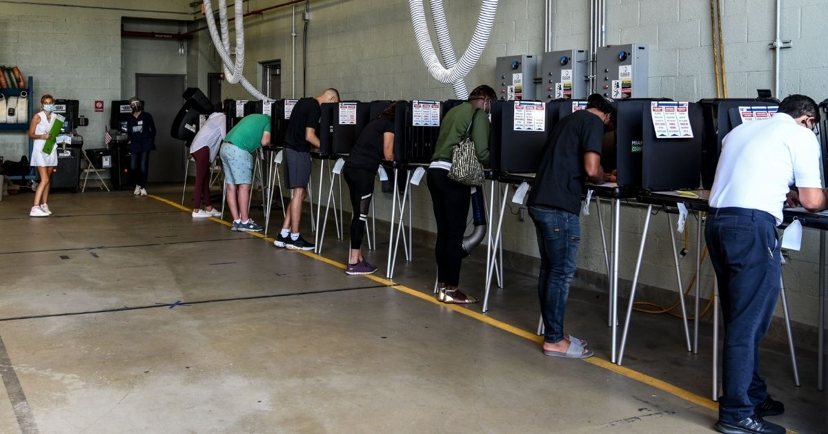 Voters cast their ballots at the Indian Creek Fire Station 4 in Miami on Tuesday.