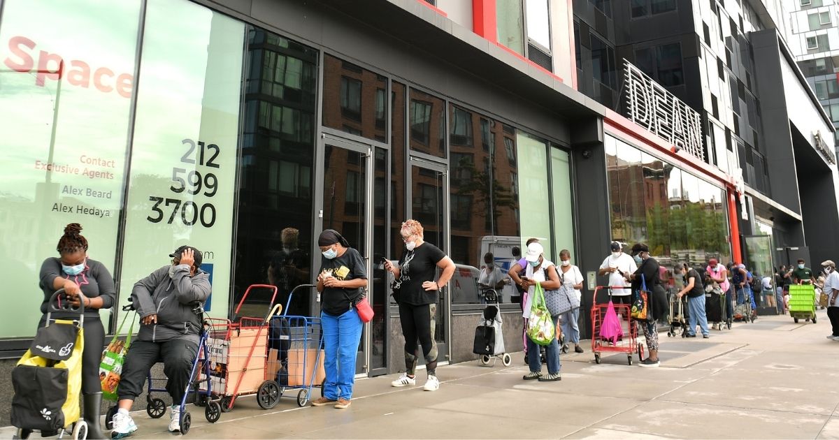 New Yorkers in need line up to receive free produce during a Pop-Up Food pantry event hosted by Food Bank for New York City at Barclays Center on Sept. 10, 2020, in New York City.