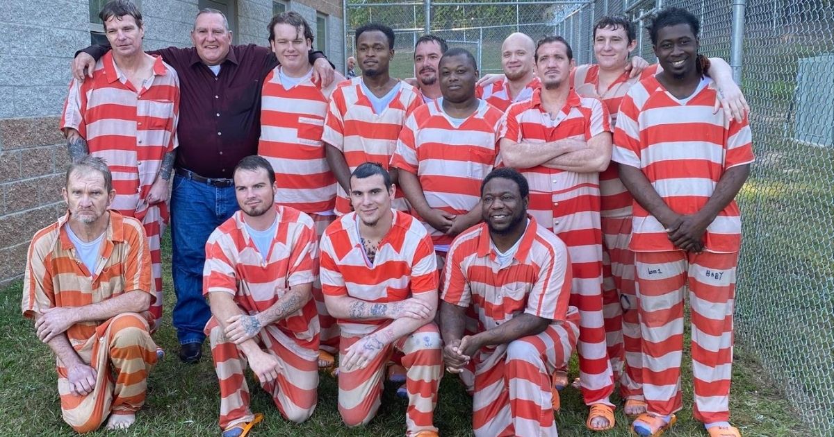 Thirteen of the 17 inmates at the Covington County Correctional Facility that were baptized in October.
