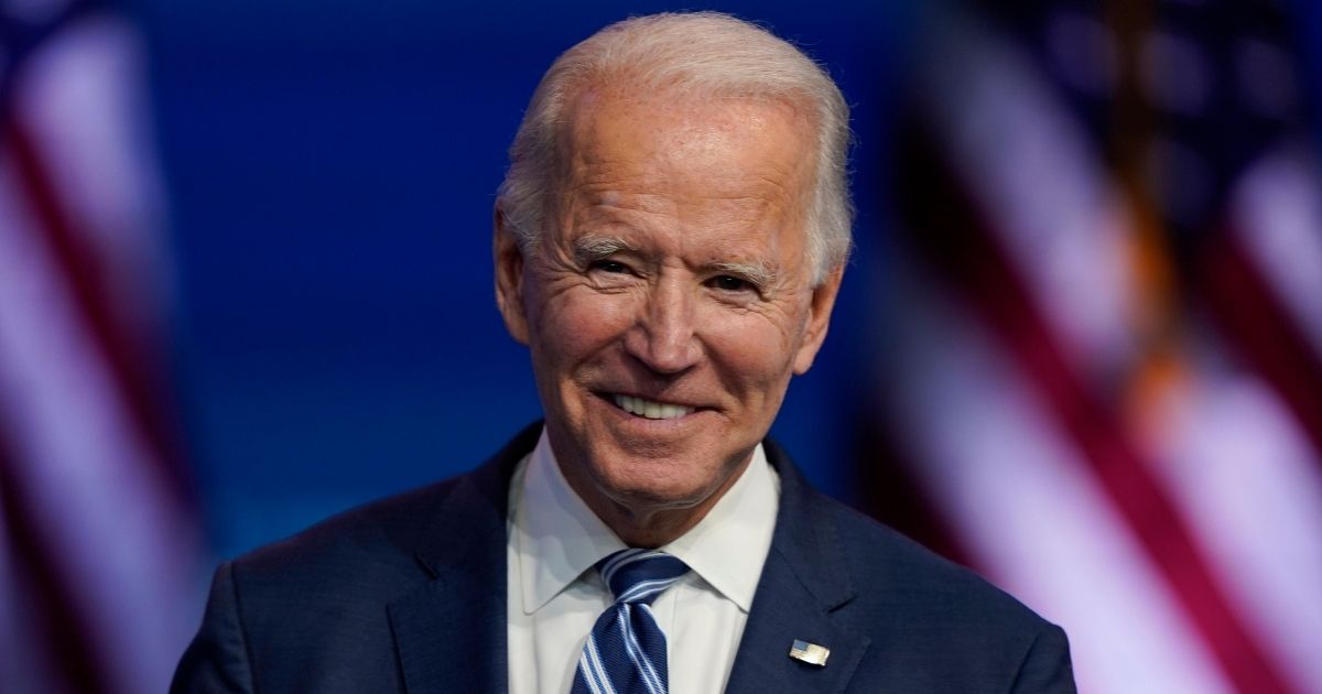 Joe Biden smiles as he speaks Tuesday at The Queen theater in Wilmington, Delaware.