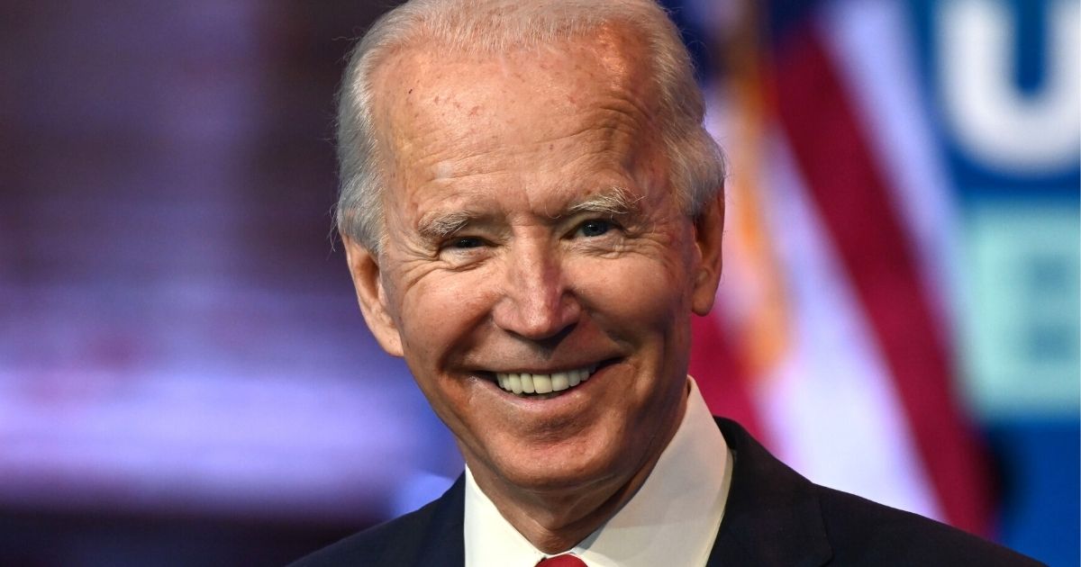 Democratic presidential candidate Joe Biden grins during a news conference at the Queen theater in Wilmington, Delaware, on Monday.