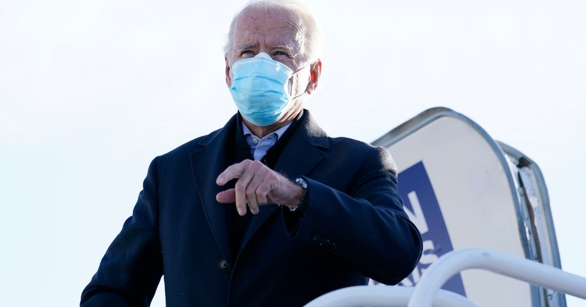 Democratic presidential nominee former Vice President Joe Biden boards his campaign plane at New Castle Airport in New Castle, Delaware, on Tuesday en route to Scranton, Pennsylvania.