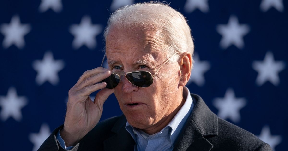 Democratic presidential nominee Joe Biden takes off his sunglasses while speaking at a campaign stop at Community College of Beaver County on Monday in Monaca, Pennsylvania.