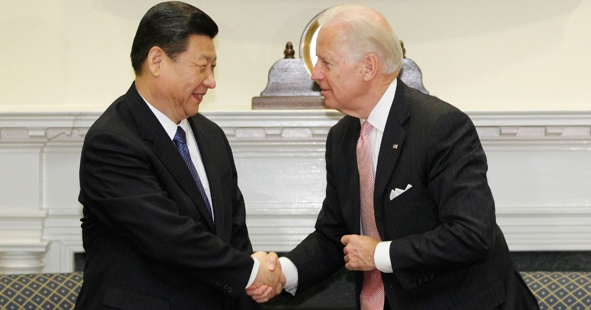 Then-U.S. Vice President Joe Biden meets with then-Chinese Vice President Xi Jinping in the Roosevelt Room at the White House in Washington on Feb. 14, 2012.