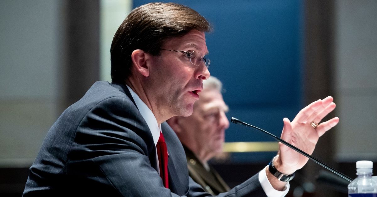 Secretary of Defense Mark Esper, front, and Chairman of the Joint Chiefs of Staff General Mark Milley, back, testify before the House Armed Services Committee hearing on "Department of Defense Authorities and Roles Related to Civilian Law Enforcement" on July 9, 2020, on Capitol Hill in Washington, D.C.