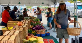 Customers and vendors at the Farmers Market in Key West, Florida, wear protective masks amid the coronavirus pandemic on Sept. 17.