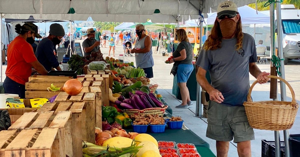 Customers and vendors at the Farmers Market in Key West, Florida, wear protective masks amid the coronavirus pandemic on Sept. 17.