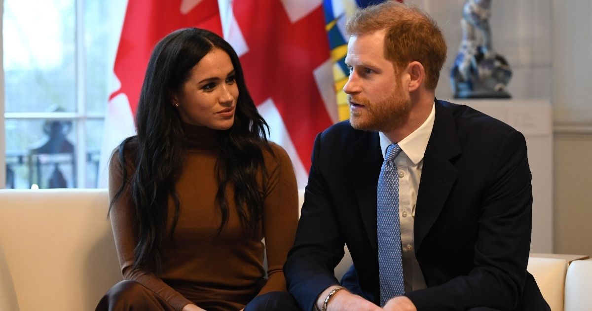 Britain's Prince Harry, Duke of Sussex, and Meghan, Duchess of Sussex, gesture during their visit to Canada House in London on Jan. 7, 2020.