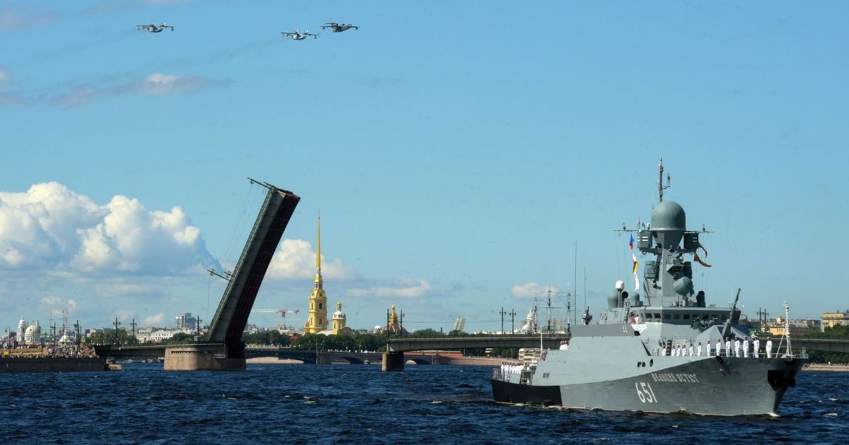 Russian warships sail on the Neva river during the Navy Day parade in Saint Petersburg on July 26.