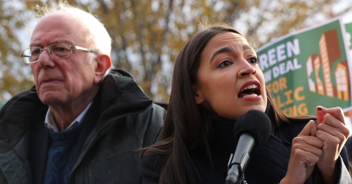 Sen. Bernie Sanders of Vermont and Rep. Alexandria Ocasio-Cortez of New York hold a news conference outside the U.S. Capitol on Nov. 14, 2019, to introduce legislation to transform public housing as part of their Green New Deal proposal.
